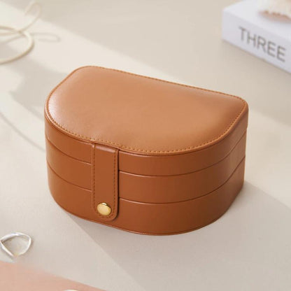 Brown shell-shaped 3-tier jewelry box with flip-top lid and gold-tone clasp