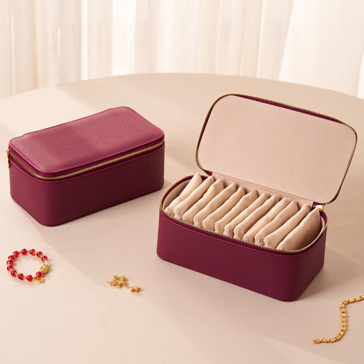 Wine red PU jewelry storage case with open lid and beige insert plus 12 zip pouches