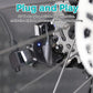Black charging adapter plugged near bike components with visible indicator light