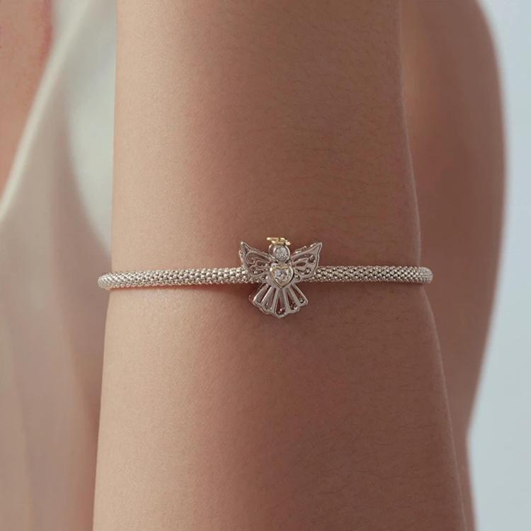 Angel charm bead on a silver beaded bracelet with heart crystal centerpiece