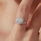 Heart-shaped moissanite ring in sterling silver with pavé halo and band