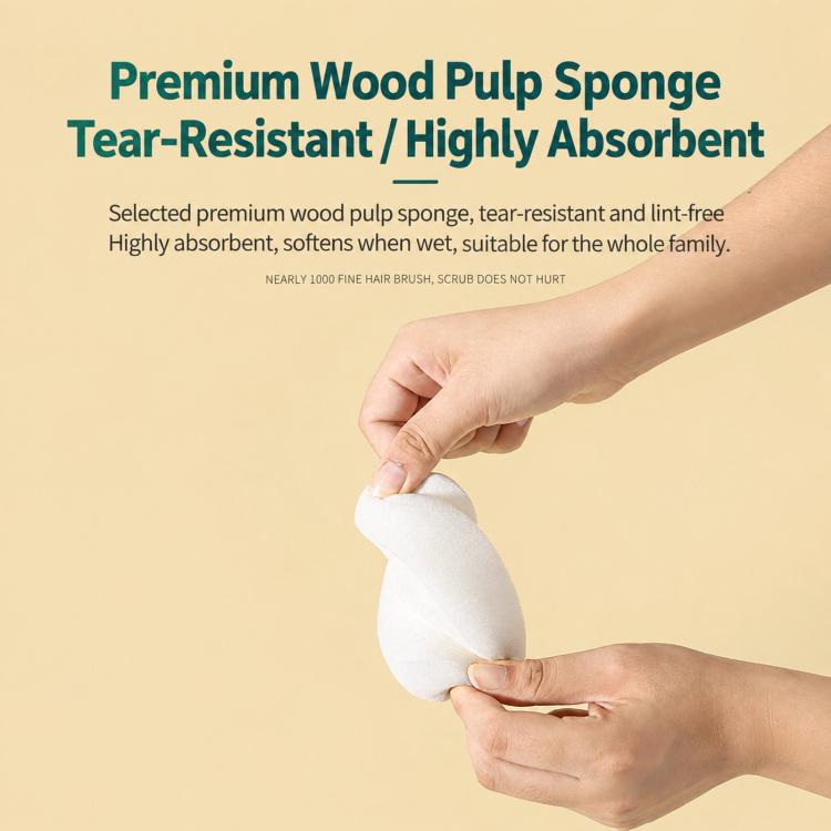 White wood pulp sponge piece shown in hands, attached to a silicone scrubber back side.