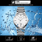 Quartz wristwatch with white dial, Roman numerals, date window, and stainless steel band