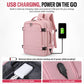 Pink travel backpack with USB charging cable connected to a power bank.