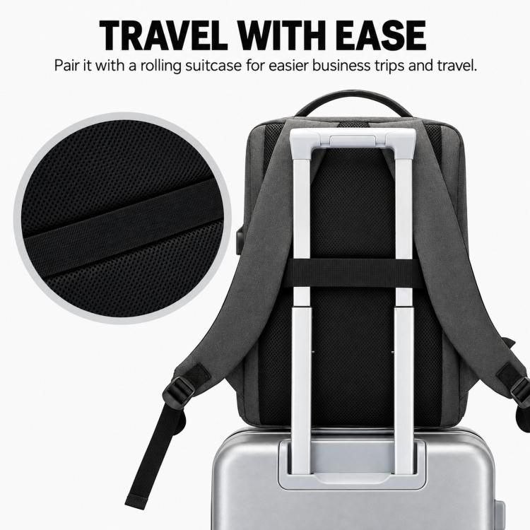 Gray laptop backpack with rear luggage strap for attaching to a rolling suitcase