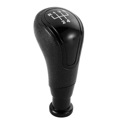Black manual gear shift knob with gear position markings on the top