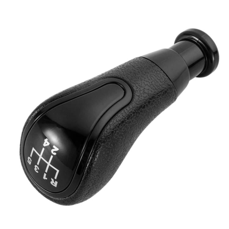 Black manual gear shift knob showing reverse and forward gear markings on top