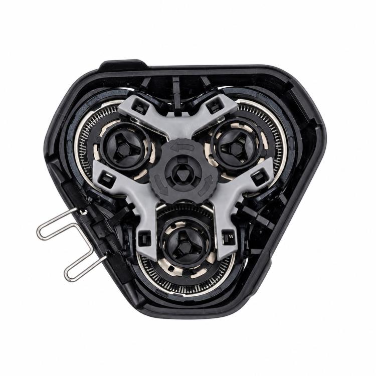 Disassembled triple shaver head assembly with cutter modules and internal gears