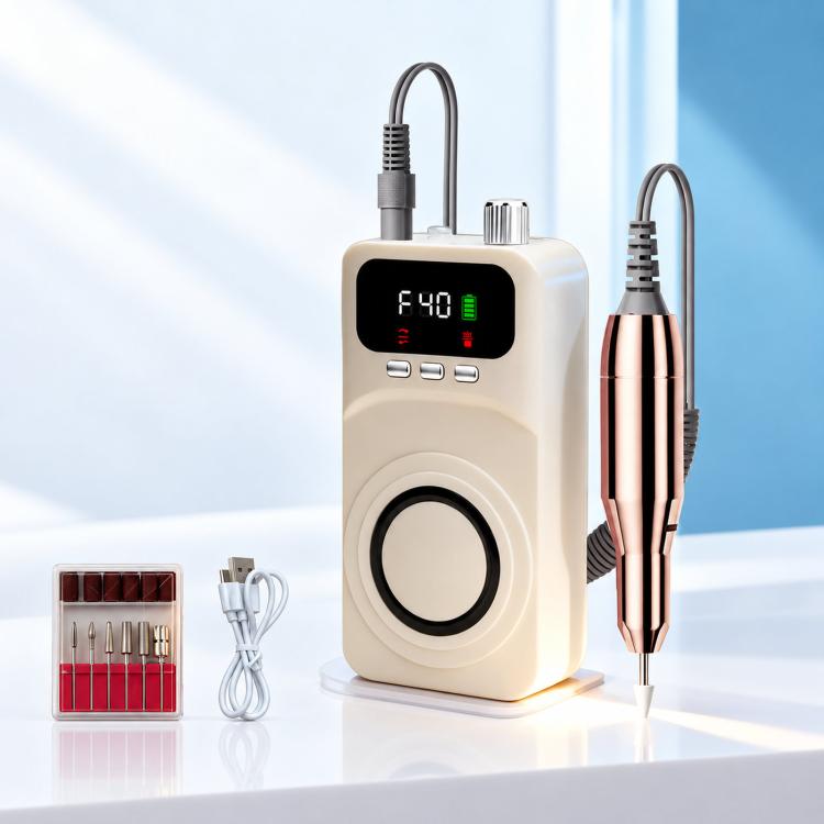 Beige cordless nail drill machine with rose-gold handpiece, cords, and bit case