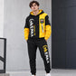 Teen hoodie and jogger set, yellow sleeves and black body with “ENAM” print on legs