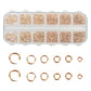 Gold and white open jump rings set with mixed sizes in clear storage box and loose rings