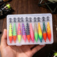 Fishing lure set in clear tackle box held in hand, colorful squid jigs with hooks