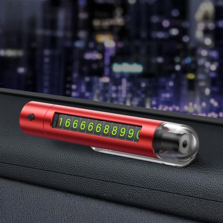 Red car safety hammer with flip-out parking number plate on a dashboard