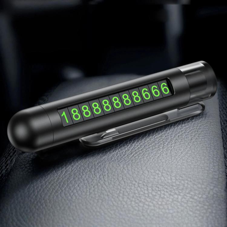Dark gray car safety hammer with flip-out parking number plate on a seat