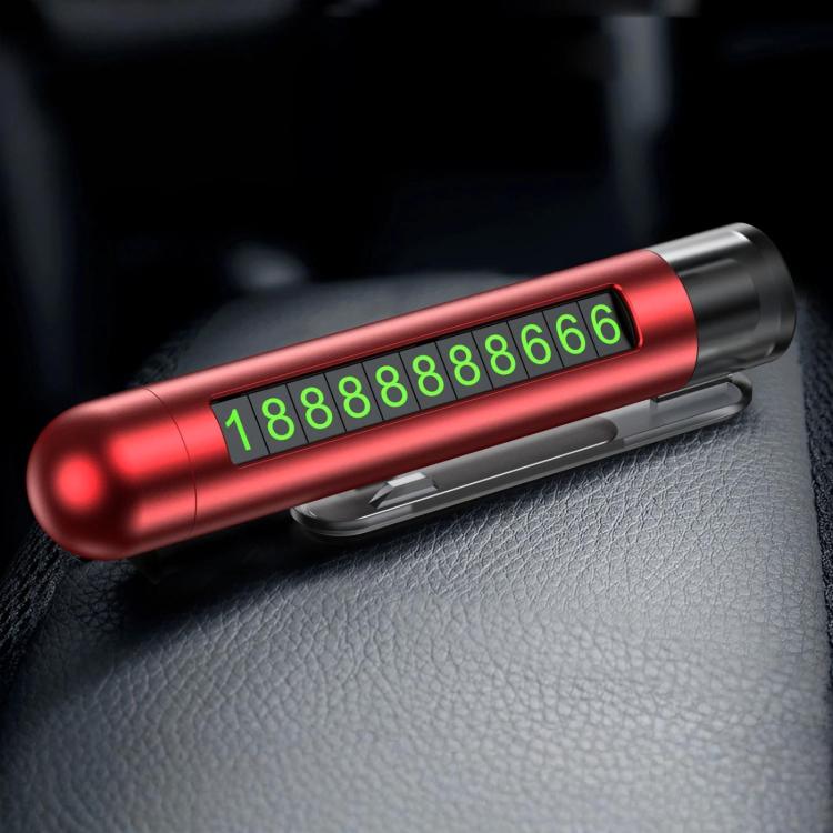 Red car safety hammer with flip-out parking number plate on a car seat