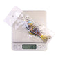 Multi-segment hard fishing swimbait lure on digital weight scale