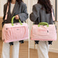 Pink nylon rolling duffel bag carried by a woman with crossbody strap and wheels