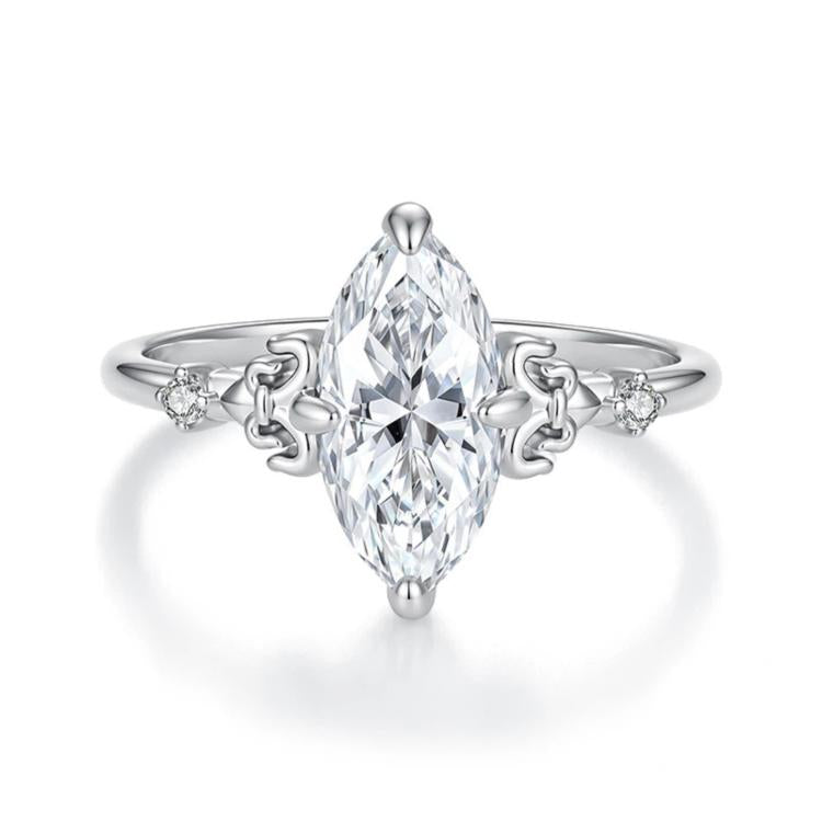 Sterling silver teardrop moissanite ring with prong setting and side accent stones