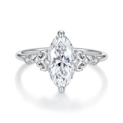 Sterling silver teardrop moissanite ring with prong setting and side accent stones