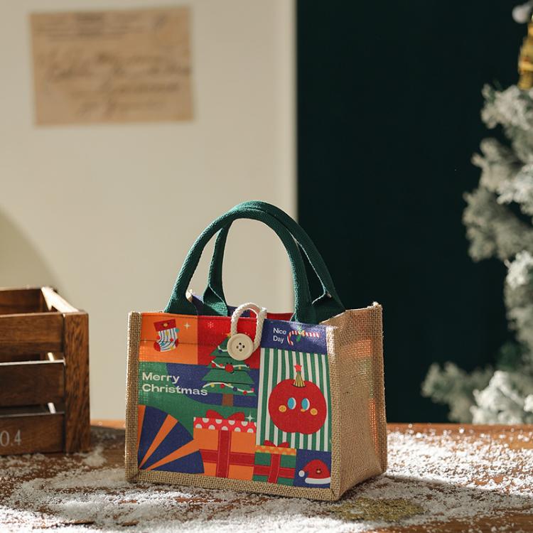 Jute Christmas tote bag with green handles and “Merry Christmas” front design
