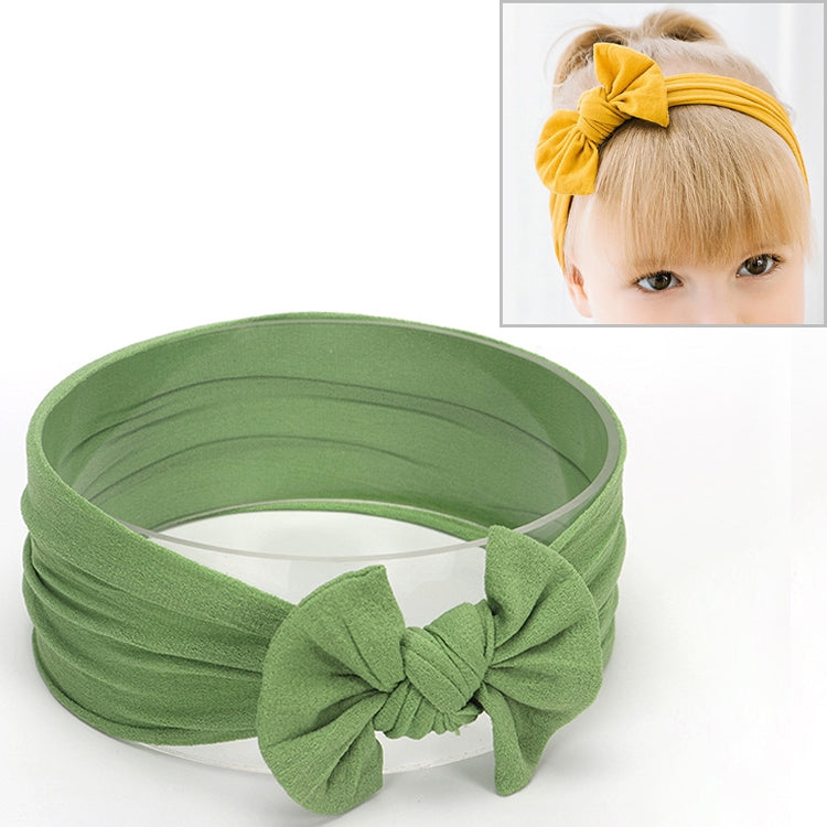 Infant hair bow headband in sage green with large knotted bow