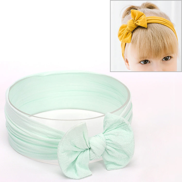 Mint green infant bowknot headband with wide fabric band and large bow detail