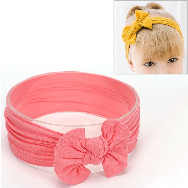 Light pink infant bowknot headband with wide fabric band and large knotted bow