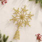 Gold wire snowflake topper with faux pearl beads and coiled wire spring stem.