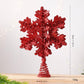 Glitter red snowflake tree topper with spiral metal stem, full view