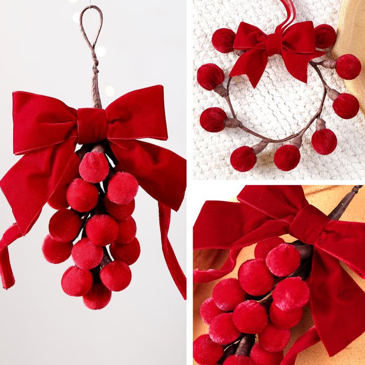 Red ribbon bow pom-berry wreath ornament, close-up view