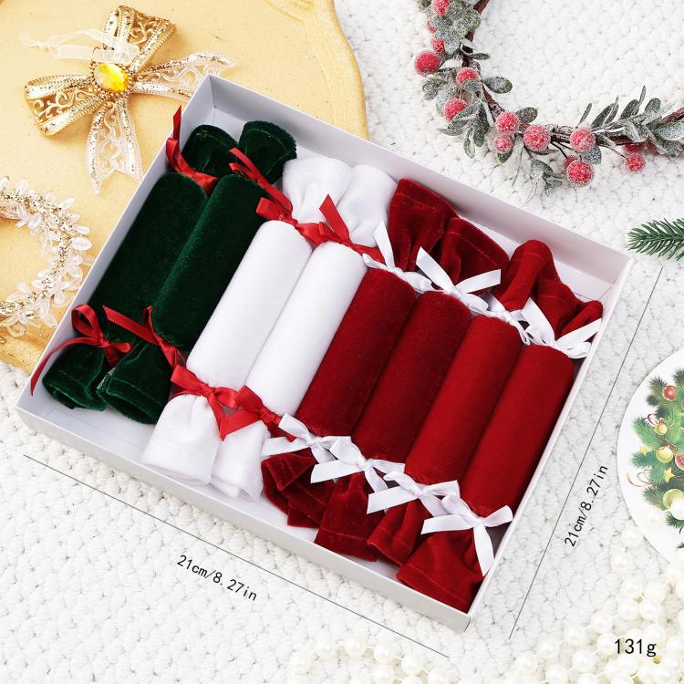 Plush candy ornament set with green, white, and red velvet rolls in a gift box