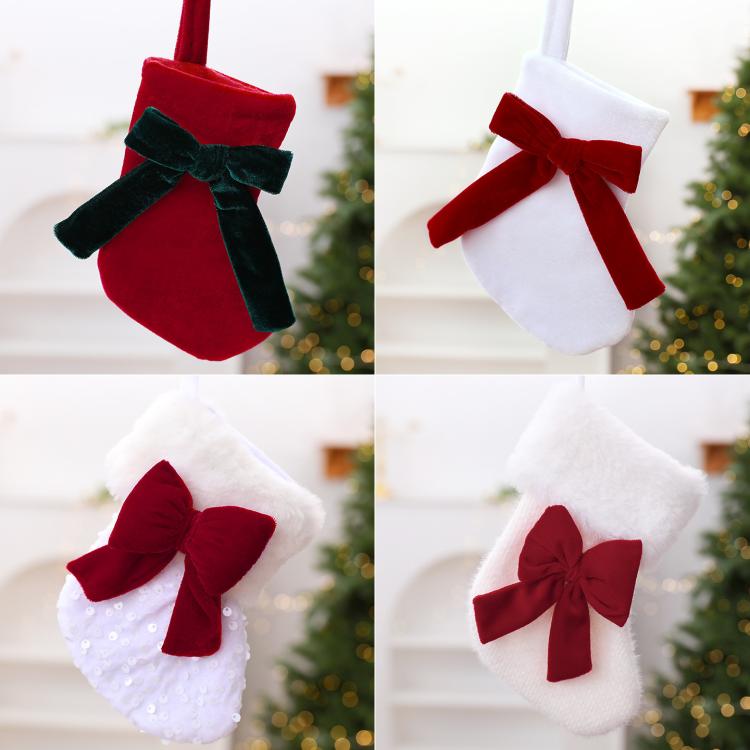 Pair of hanging stockings: red with green plush bow and white with red bow