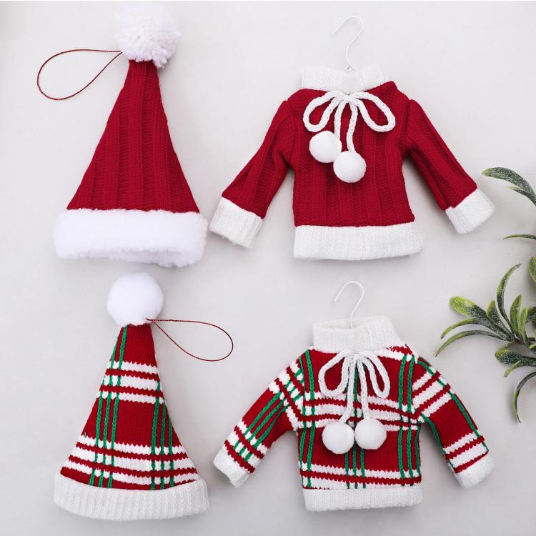 Set of mini knitted sweater and hat ornaments in red and green/white striped patterns.