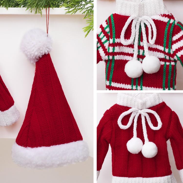 Close-up mini knitted sweater ornament: red knit with green/white stripes and bow pom.