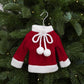 Mini knitted red sweater ornament with white bow and three pom pom accents.