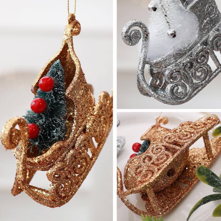 Split view of glitter sleigh ornaments: gold and silver with red berry details