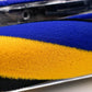 Close-up of blue and yellow fluffy brush roller inside clear head cover