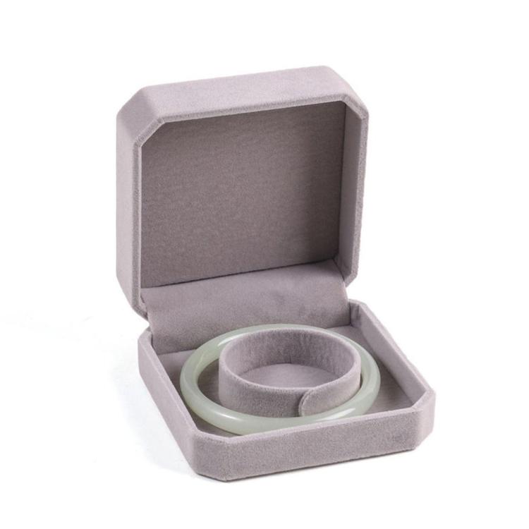 Gray octagonal velvet jewelry box, open with bracelet/bangle holder and jewelry inside