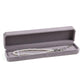 Gray octagonal velvet jewelry box, open with long pearl necklace on padded tray