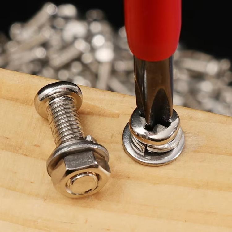 Stainless steel hex bolts with nuts on wood board during fastening, close-up