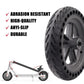 Black solid rear wheel and disc brake rotor, shown with scooter