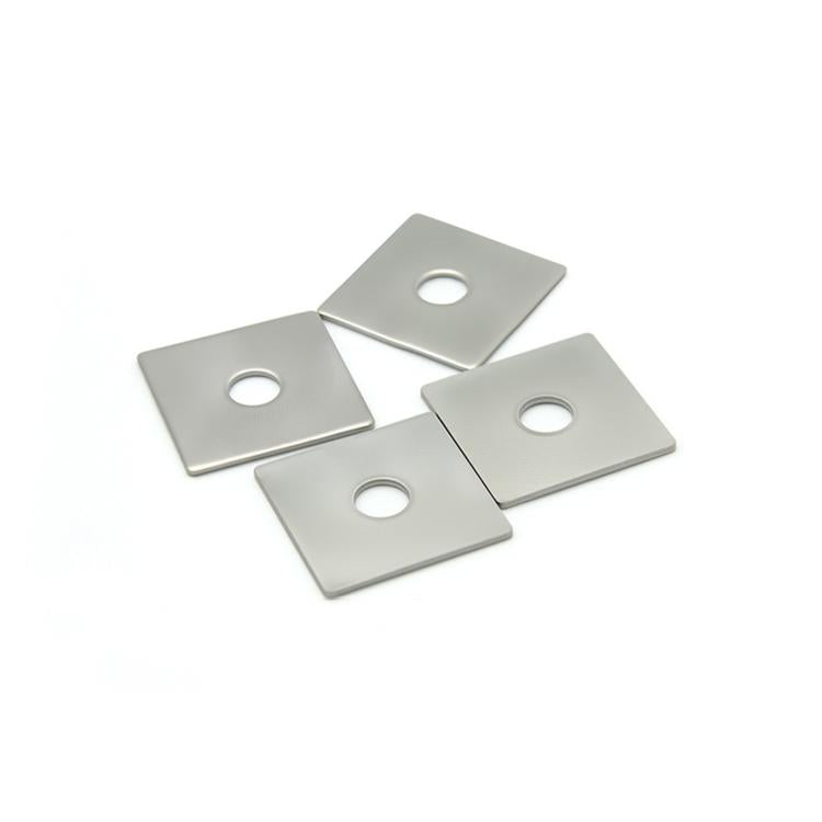 Set of stainless steel square flat washers with round center holes