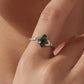Green marquise agate sterling silver leaf ring worn on a finger