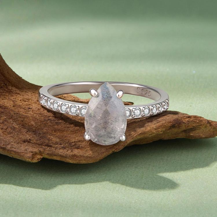 Sterling silver ring with teardrop center stone and pavé-set band