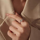 Sterling silver ring with teardrop center stone on finger