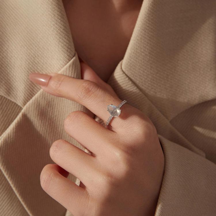 Sterling silver ring with teardrop center stone on finger