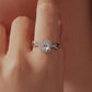 Sterling silver moissanite ring with oval center stone on a finger