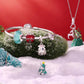 Charm bracelet with aqua and red beads plus Christmas tree and bell charms