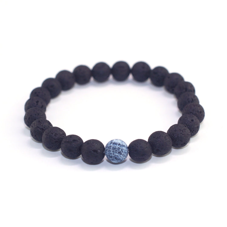 Matte black lava bead bracelet with single light blue crackle bead