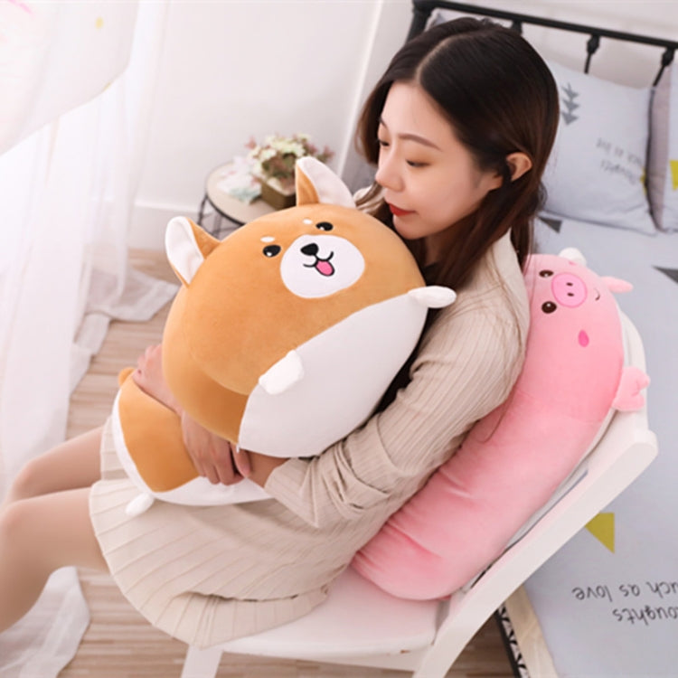 Orange dog plush cushion pillow with white muzzle and tongue, held by a child